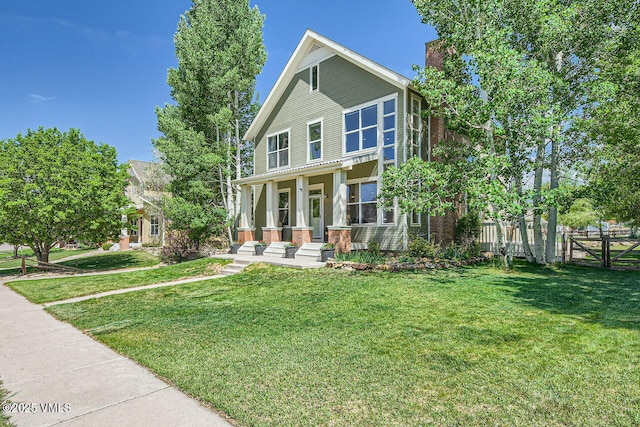 41 Wren Ct, Eagle, CO 81631 - view of front facade with brick siding, a porch, and a chimney