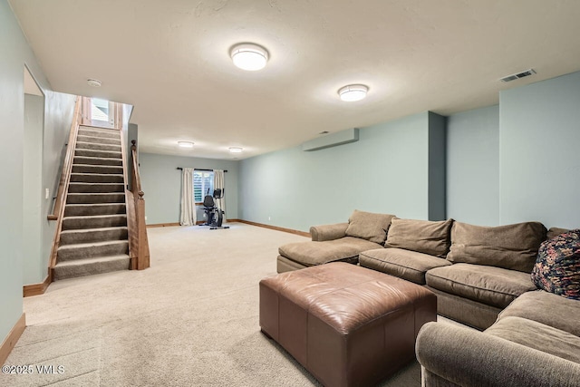 41 Wren Ct, Eagle, CO 81631 - carpeted living room with stairway, baseboards, and a wall mounted air conditioner