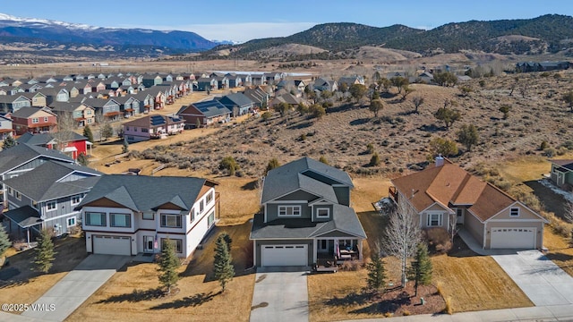 drone / aerial view featuring a mountain view and a residential view