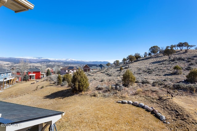 property view of mountains featuring a residential view