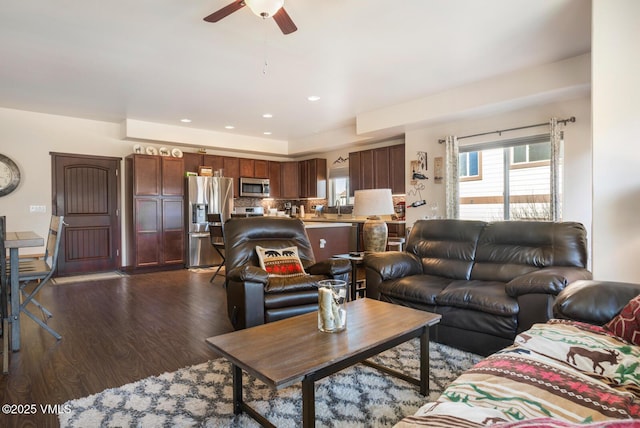 living area featuring recessed lighting, dark wood-style flooring, and a ceiling fan