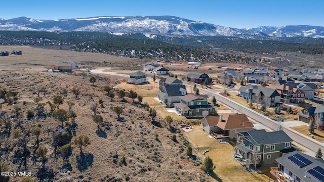 birds eye view of property featuring a mountain view and a residential view