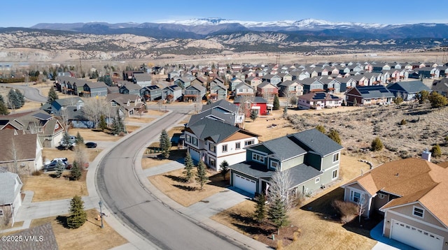 aerial view with a mountain view and a residential view