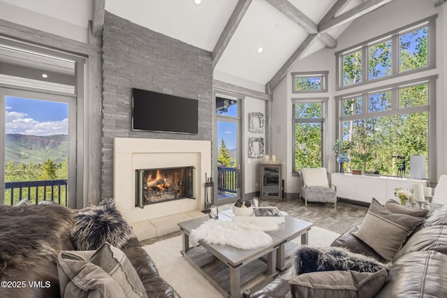 25 W Timber Draw Dr, Edwards, CO 81632 - living room with beamed ceiling, a stone fireplace, high vaulted ceiling, and recessed lighting