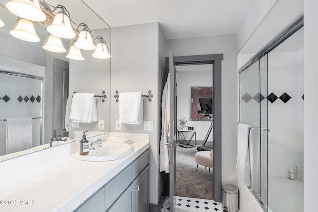 25 W Timber Draw Dr, Edwards, CO 81632 - ensuite bathroom featuring vanity and shower / bath combination with glass door