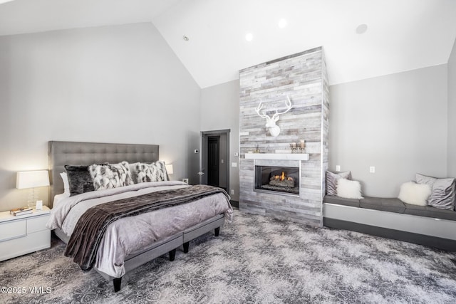 25 W Timber Draw Dr, Edwards, CO 81632 - bedroom featuring high vaulted ceiling, a fireplace, and carpet flooring