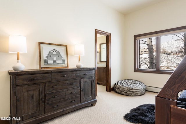 living area with a baseboard radiator and light colored carpet