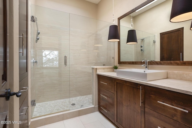 bathroom featuring a stall shower, tile patterned flooring, and vanity