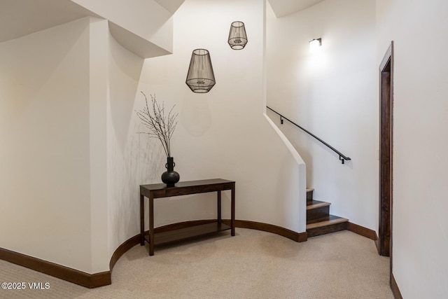 stairs with carpet and baseboards