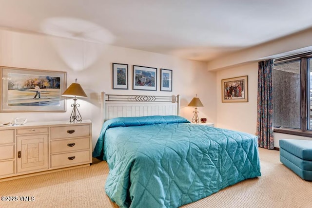 bedroom with light colored carpet