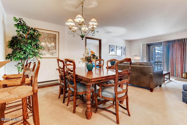 dining area with a notable chandelier and light colored carpet