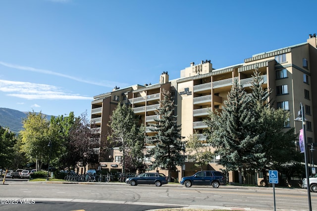 view of building exterior with a mountain view