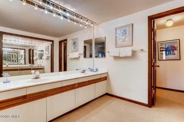 bathroom featuring vanity and baseboards