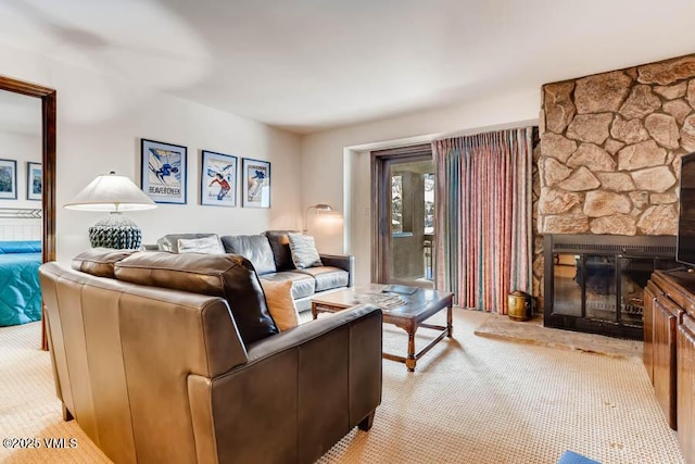 living room with a fireplace and light colored carpet