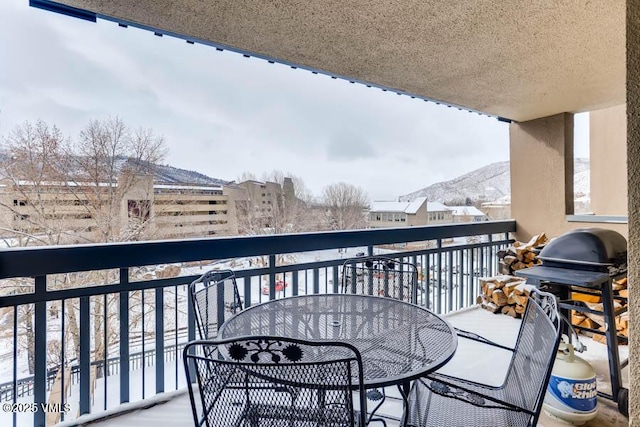 balcony featuring a mountain view