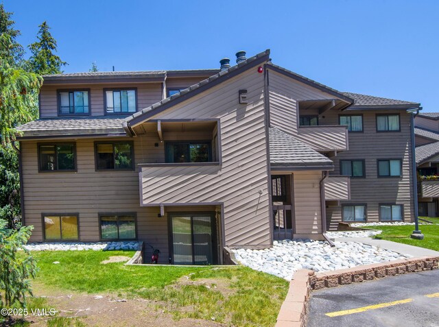 1050 W Beaver Creek Blvd Unit 201, Avon, CO 81620 - view of building exterior featuring uncovered parking