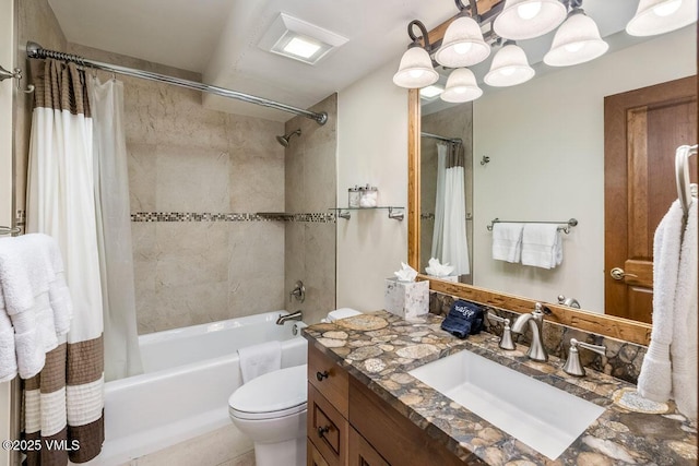 bathroom featuring vanity, toilet, and shower / tub combo with curtain