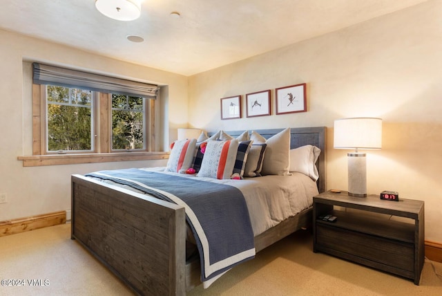 bedroom with light colored carpet