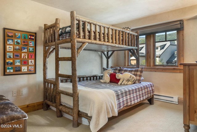 carpeted bedroom with a baseboard radiator