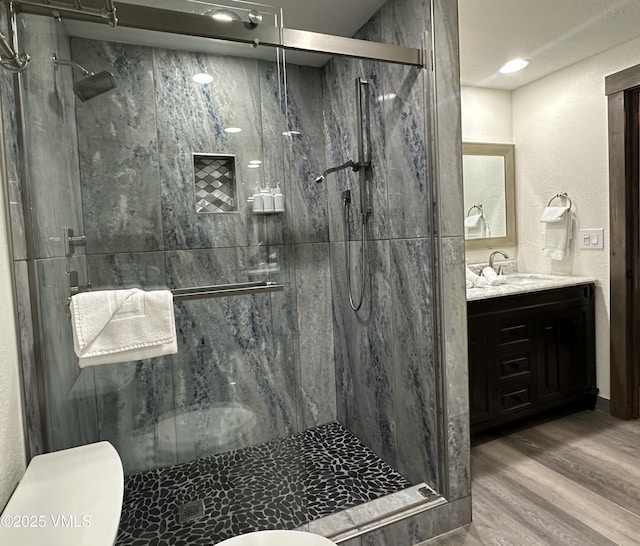 120 Offerson Rd Unit A160, Beaver Creek, CO 81620 - bathroom featuring toilet, vanity, wood finished floors, and a marble finish shower