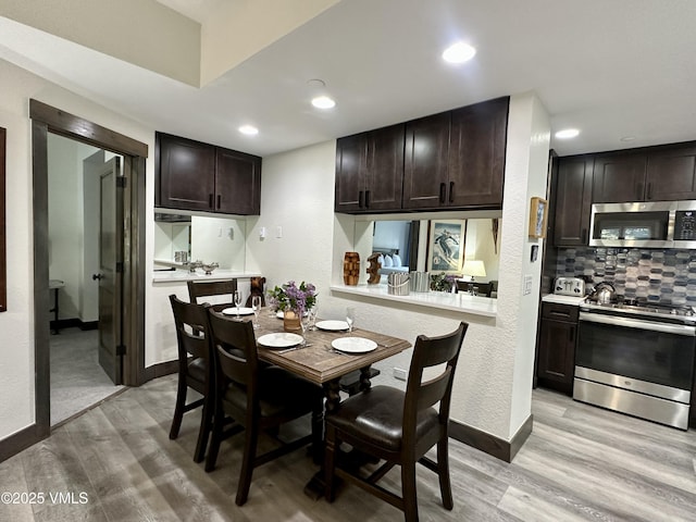 120 Offerson Rd Unit A160, Beaver Creek, CO 81620 - dining room with light wood finished floors, baseboards, and recessed lighting