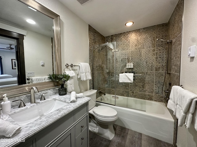 120 Offerson Rd Unit A160, Beaver Creek, CO 81620 - full bath featuring wood finished floors, vanity, enclosed tub / shower combo, toilet, and a textured wall