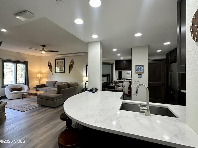 120 Offerson Rd Unit A160, Beaver Creek, CO 81620 - kitchen with a sink, freestanding refrigerator, a peninsula, open floor plan, and wood finished floors