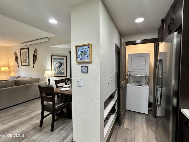 120 Offerson Rd Unit A160, Beaver Creek, CO 81620 - washroom with stacked washer / dryer, light wood-style floors, recessed lighting, and a textured wall