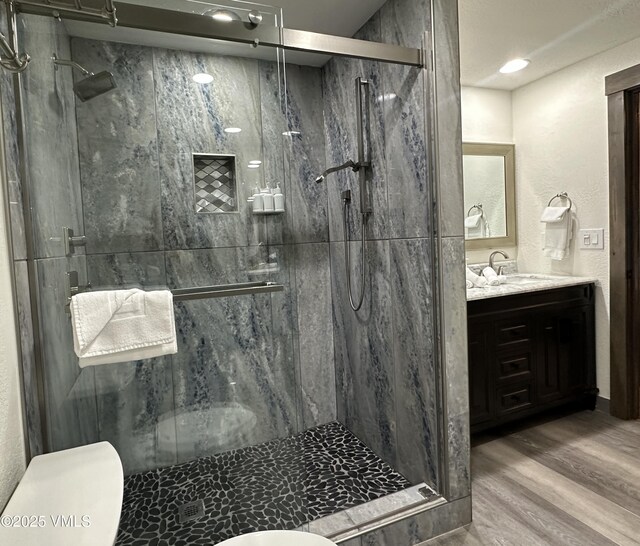 120 Offerson Rd Unit A160, Beaver Creek, CO 81620 - bathroom with toilet, vanity, wood finished floors, and a marble finish shower