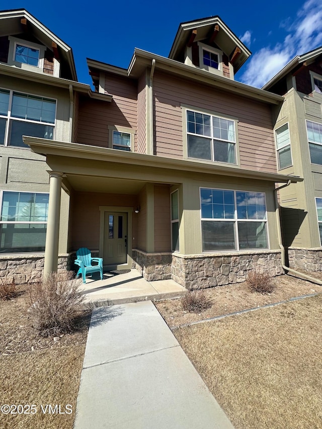 view of front facade featuring stone siding