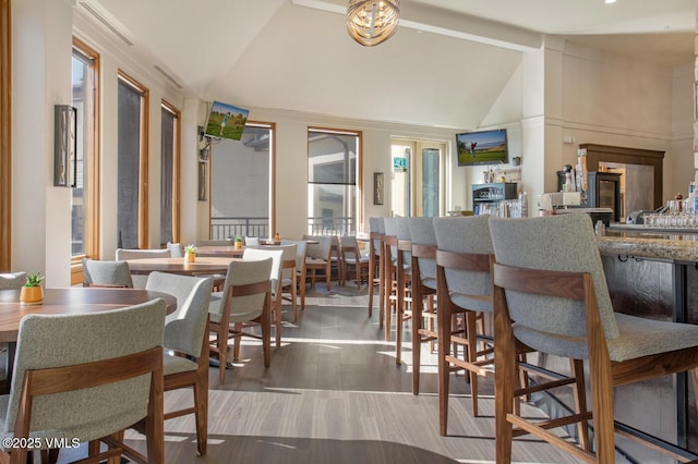 120 Offerson Rd Unit 2320, Beaver Creek, CO 81620 - dining area featuring vaulted ceiling and wood finished floors