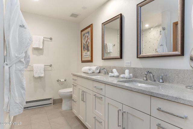 120 Offerson Rd Unit 2320, Beaver Creek, CO 81620 - bathroom featuring a baseboard radiator, double vanity, and tile patterned floors