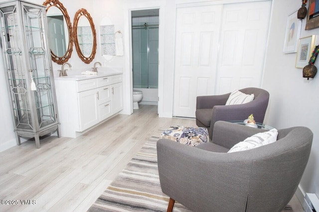 sitting room with light wood-type flooring