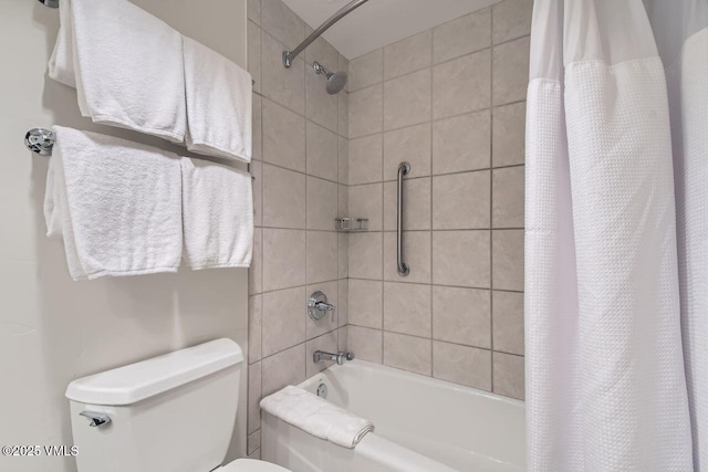 bathroom with shower / bath combination with curtain and toilet