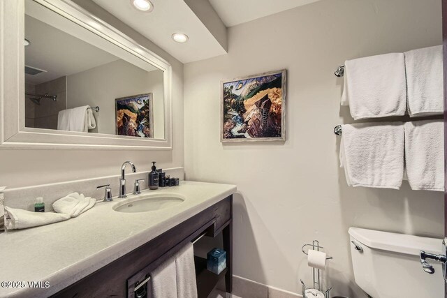 bathroom with vanity and toilet