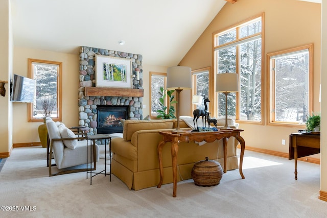 2 Anvil Cir, Edwards, CO 81632 - living room featuring light colored carpet, a stone fireplace, and lofted ceiling