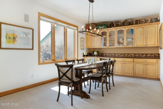 2 Anvil Cir, Edwards, CO 81632 - dining area featuring light carpet and a chandelier