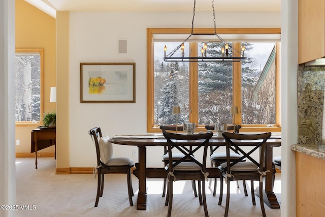 2 Anvil Cir, Edwards, CO 81632 - dining room with a chandelier, carpet floors, and healthy amount of natural light