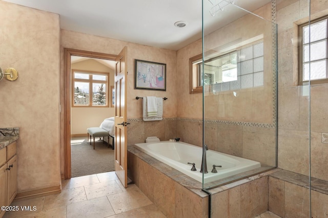 2 Anvil Cir, Edwards, CO 81632 - full bath with a bath, vanity, and stone tile floors