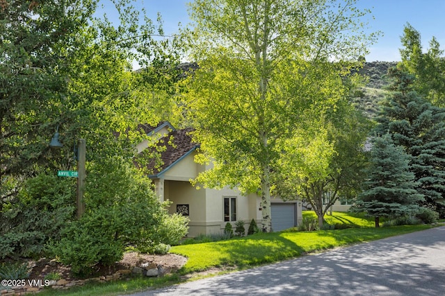 2 Anvil Cir, Edwards, CO 81632 - view of side of property with stucco siding and a lawn