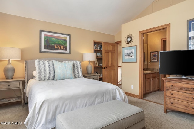 2 Anvil Cir, Edwards, CO 81632 - bedroom with lofted ceiling, light carpet, and connected bathroom