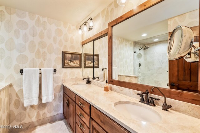 bathroom featuring vanity and a shower with shower door