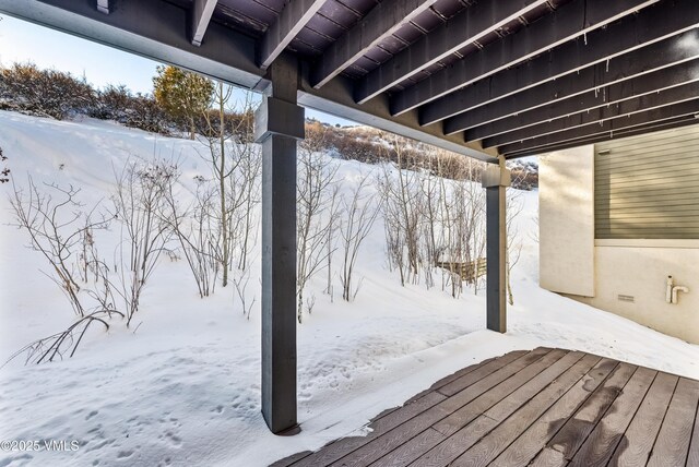 view of snow covered deck