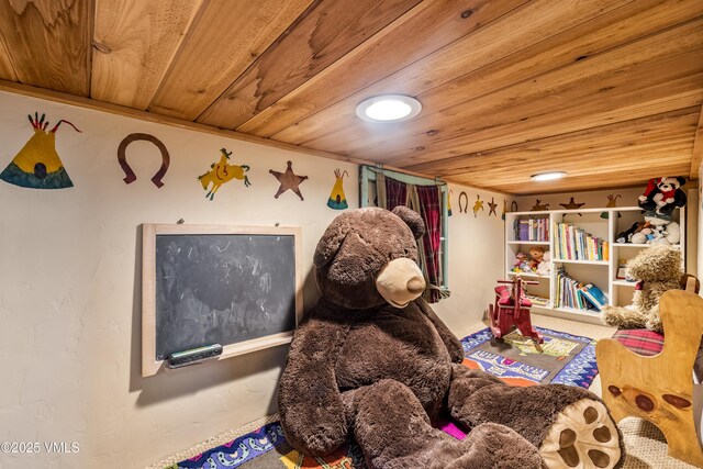 game room with wood ceiling