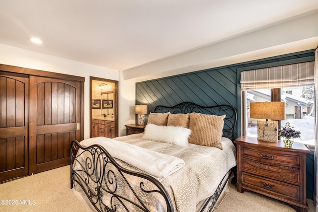 carpeted bedroom featuring wooden walls