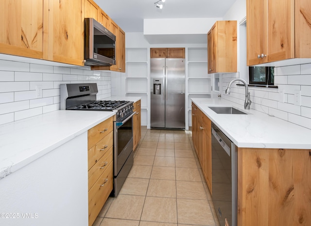 2403 Draw Spur Unit 2, Avon, CO 81620 - kitchen featuring stainless steel appliances, light tile patterned floors, backsplash, open shelves, and light stone counters