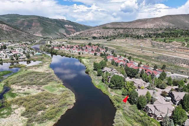 601 Crazy Horse Cir Unit 601, Edwards, CO 81632 - view of mountain background featuring a nearby body of water and nearby suburban area