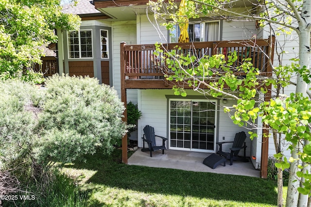 601 Crazy Horse Cir Unit 601, Edwards, CO 81632 - rear view of house with a patio area and a balcony