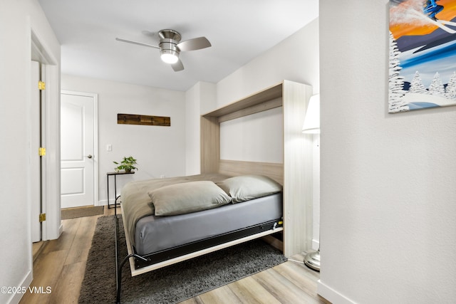 601 Crazy Horse Cir Unit 601, Edwards, CO 81632 - bedroom with wood finished floors and a ceiling fan