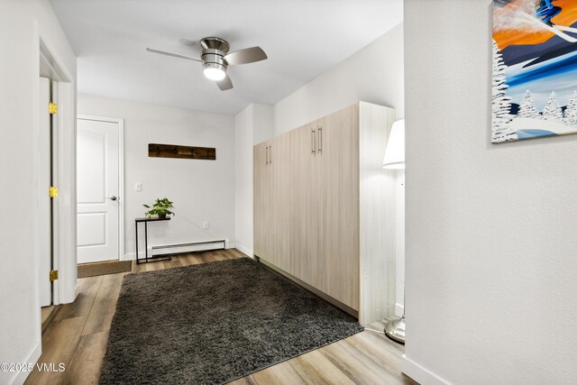 601 Crazy Horse Cir Unit 601, Edwards, CO 81632 - hallway with a baseboard heating unit and wood finished floors